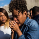 A woman cries after being prayed over during a protest near the CVS pharmacy that was set on fire during rioting after the funeral of Freddie Gray on April 28, 2015, in Baltimore.
Andrew Burton/Getty Images